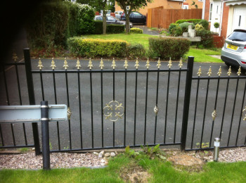 Wrought iron gates outside somebody's house