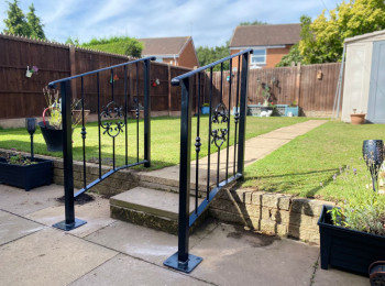 Wrought iron railing used in somebody's back garden
