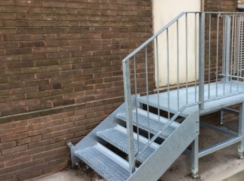 An iron handrail on some business steps